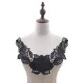 Close-up showing the intricate floral embroidery and PU leather detail of the black collar - Black