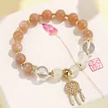 Elegantes Armband aus Sonnenstein und weißem Quarz mit goldenem Traumfänger-Anhänger - Sonnenstein Weißer Kristall Quasten-Armband
