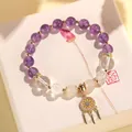 Elegantes lila und weißes Kristallperlenarmband mit goldenem Traumfänger-Anhänger - Amethyst Quasten-Armband