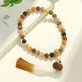 Handgeschnitztes Lotus-Bodhi-Armband mit weiß-goldenem Verlaufsquaste - Lotusblume Handheld