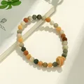 Handgeschnitztes Lotus-Bodhi-Perlenarmband mit mehrfarbigen Erdtönen und einem Ring-Anhänger - Doppelschleife Traum Lotus Handheld