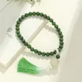 Elegant green lotus engraved Bodhi bead bracelet featuring a gradient silk tassel ornament - Imperial Green Six-Word Mantra Handheld