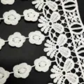 Close-up of white water-soluble milk silk embroidery lace trim with floral patterns - 6.5 Meters/Strip / White