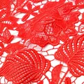Macro detail of red water-soluble lace fabric with intricate leaf embroidery - Red