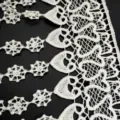Detailed close-up of white water-soluble milk silk lace trim with heart patterns - Tassel Fringe Heart Style / Each Piece Pack / White