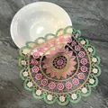 Detailed view of a round embroidered lace placemat with colorful floral patterns - 3#