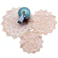 Close-up detail of intricate beige lace cutout floral embroidery on round coasters - Diameter 15cm / Beige