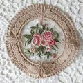 Macro view of vintage round lace coaster with intricate floral embroidery details - Diameter 11.5cm / Camel