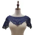 Detail view of navy blue lace shawl with exquisite floral embroidery on mannequin - Tops / Dark Blue