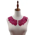 Detailed view of magenta water-soluble lace collar embroidery on a mannequin torso - Fuschia