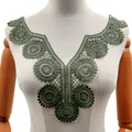 Detail of dark green water-soluble lace collar applique on a white mannequin. - Olive Green