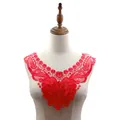 Detailed view of a vibrant red embroidered lace floral collar displayed on a mannequin - Red