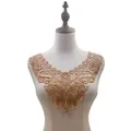 Detailed view of golden water-soluble butterfly lace collar applique on dress form - Gold Coffee