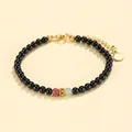 Elegant handmade black onyx beaded bracelet featuring rhodochrosite and gold accents - Rhodochrosite Prehnite Black Agate Bracelet