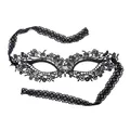 Macro view of a black water-soluble lace masquerade mask with elegant floral hollow patterns. - Black