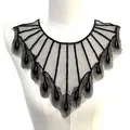 Detailed view of black peacock feather style embroidered lace collar on mannequin - Black
