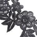 Detailed macro shot of black water-soluble floral lace embroidery applique for DIY - Black