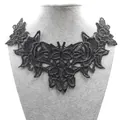 Detailed macro view of black butterfly lace embroidery applique for DIY craft sewing - Black