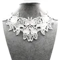 Detail view of white water-soluble lace embroidery with elegant butterfly patterns. - White