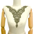 Detailed view of the olive green water-soluble lace neckline patch for DIY sewing projects. - Dark Green