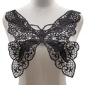 Detailed close-up view of black lace butterfly embroidered applique collar on a dress form - Black