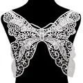 Detailed macro view of white butterfly-shaped water-soluble lace embroidery collar patch - White