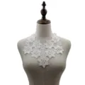 Close-up of white water-soluble lace floral collar with intricate embroidery - White