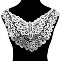 Intricate white water-soluble lace collar featuring butterfly embroidery on black mannequin - White