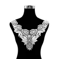 Detailed view of white water-soluble embroidered lace collar patch on mannequin - White