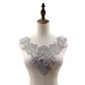 Detailed view of silver 3D floral water-soluble lace collar applique on mannequin - Gray