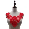 Close-up detail of a red water-soluble floral lace collar applique on a mannequin - Red