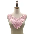 Close-up of pink water-soluble lace collar with intricate 3D butterfly embroidery - Pink