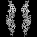 Detailed view of white water-soluble lace floral embroidery patches for DIY craft accessories. - White
