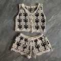 Detailed view of Bohemian hollow out crochet knit two-piece set with vest and shorts - Top And Bottom / Black