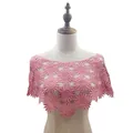 Detail view of stylish pink floral crochet lace shawl worn on a fashion mannequin torso - Tops / Dusty Pink