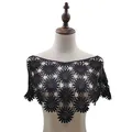 Detailed view of a black floral lace crochet shawl on a female mannequin torso - Tops / Black