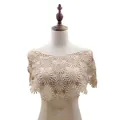 Close-up detail of beige lace crochet shawl with hollow-out floral pattern on mannequin - Tops / Light Coffee