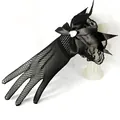 Close-up of black fishnet bridal glove with large satin bow and heart rhinestone detail. - Black