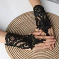 Elegant black lace fingerless gloves with floral embroidery for bridal and wedding wear. - One Size / Black