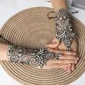 Elegant short bridal fingerless lace gloves with delicate floral embroidery and mesh detail. - One Size / Gold Black