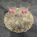 Detailed view of golden lace embroidered coaster with elegant floral patterns on marble - 25*25cm / Beige