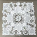 Close-up of white embroidered lace square tablecloth with vintage hollow pattern - Diameter 30cm