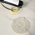 Close-up detail of a vintage round cotton lace coaster on a white marble surface - Style 87# / Diameter 17cm / Apricot