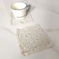 Detail view of two square beige cotton crochet lace coasters on marble tabletop - Diameter 13CM / Round Dense Crochet Vintage Style (4)
