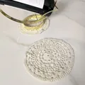 Close-up of vintage cream lace crochet coaster on white marble surface for home decor - Style 89 / Diameter 18cm / Apricot