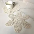 Detail of cream-colored hand-knitted cotton coaster in a vintage flower petal shape - 96# (Off-White)