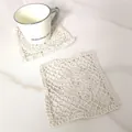 Detailed macro shot of vintage beige lace square coaster with floral crochet pattern - Round Mesh Hollow Coaster (6)