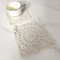 Detailed macro view of cream square hollow crochet cotton coaster with white ceramic mug - Round Sunflower Vintage Coaster (7)