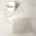 Detail view of cream retro hollow lace embroidered cotton square coaster on marble table - Square Classic Lace Coaster (12)