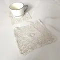 Macro view of a cream-colored vintage lace square cotton coaster with intricate crochet detail - Square Vintage Hollow Table Mat (13)